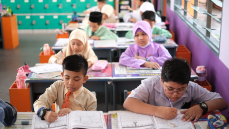 Children in classroom doing school assignments