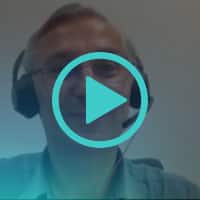 Andrew Jack wearing a headset, on a video call