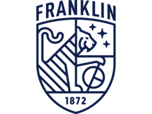 Franklin School crest featuring a stylized lion, stars, a globe, and the year 1872 in a navy blue shield.