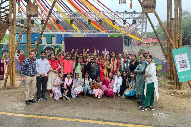 Students and teachers from Government Girls Senior Secondary School, NIT 5 at an outdoor cultural event