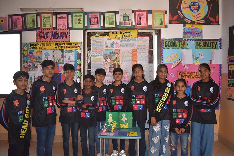 Group of students presenting a PYP exhibition project on equality and human rights