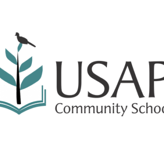 Logo of USAP Community School featuring a stylized plant growing from an open book with a bird perched on top.