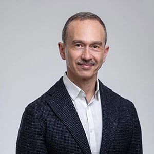 Professional Portrait of Smiling Man in Dark Blazer and White Shirt