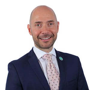 Professional Portrait of Smiling Businessman in Navy Suit and Light Pink Tie