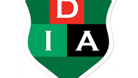 DIA school crest with red, green, and black shield design