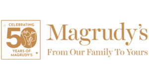 Magrudy’s 50th Anniversary logo with the text "Celebrating 50 Years of Magrudy’s – From Our Family To Yours".