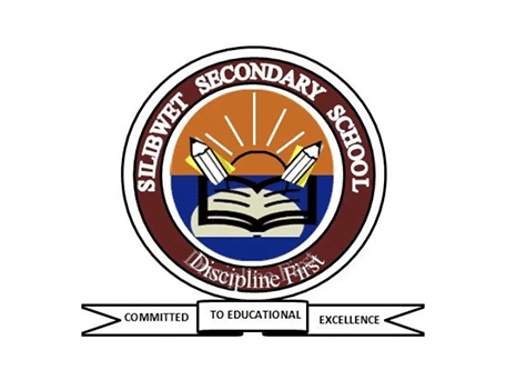 Silibwet Secondary School logo with open book, pencils, and sunrise design