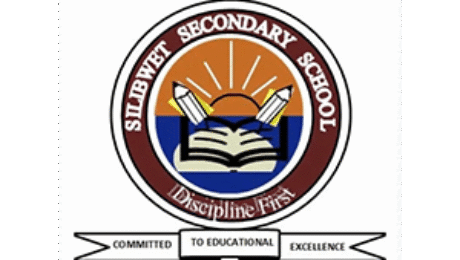 Silibwet Secondary School logo with open book, pencils, and sunrise design