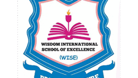 Wisdom International School of Excellence logo with open book, flame, and blue shield design