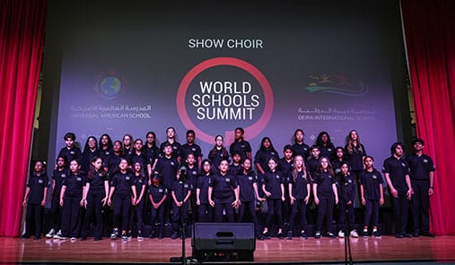 Student show choir performing on stage at the World Schools Summit.