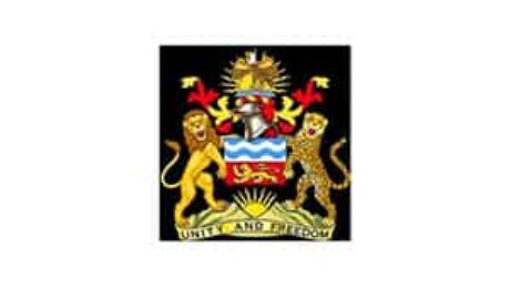 Coat of arms with lion and leopard and the motto “Unity and Freedom”.