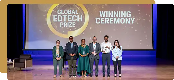 Group of award recipients and presenters standing on stage during the Global EdTech Prize winning ceremony