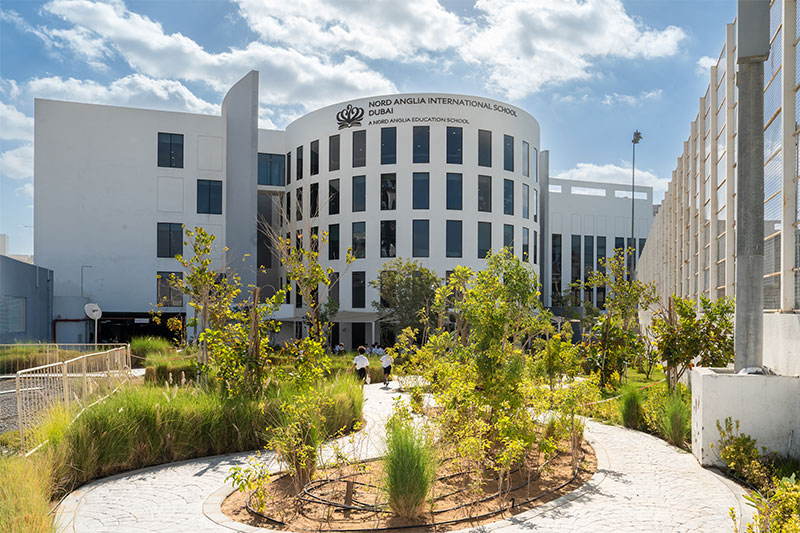 Exterior view of Nord Anglia International School Dubai featuring contemporary educational facilities and landscaped outdoor spaces.