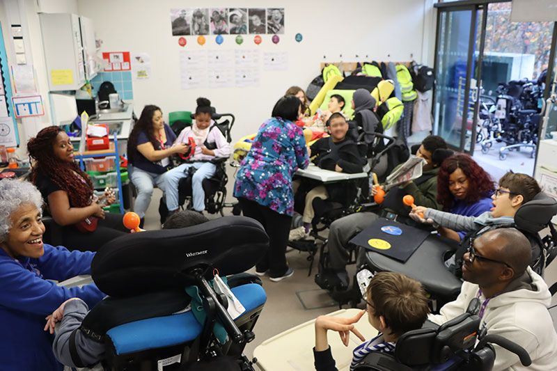 Students and educators participating in a supportive learning session tailored to individual developmental and educational needs.
