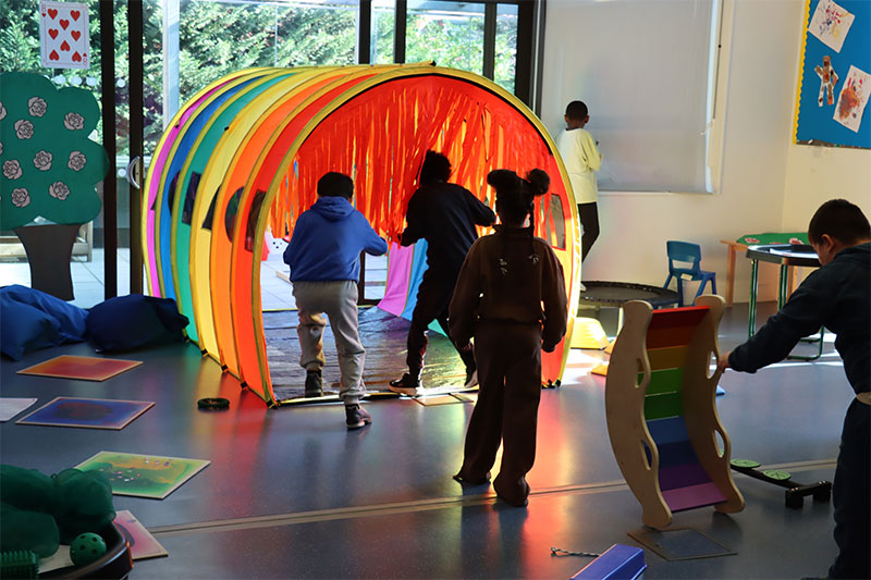 Students exploring a sensory learning environment designed to encourage movement, engagement, and inclusive educational experiences.