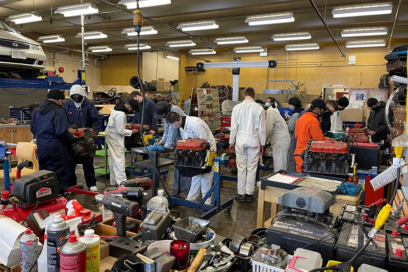 Students receiving hands-on automotive technician training in a Vancouver School Board workshop