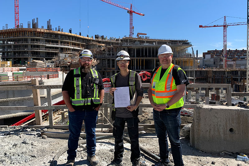 Youth apprentice with industry mentors at a construction site through Vancouver Learning Network career programs