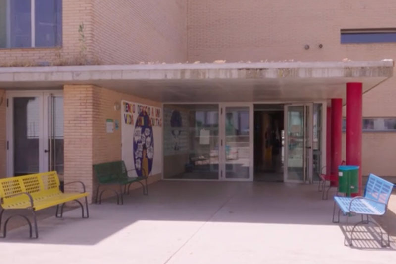 Main entrance of IES Alba Plata secondary school showcasing a welcoming educational environment