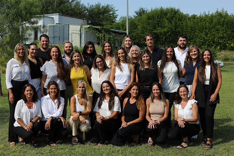 Faculty members and educational staff gathered for a team photograph, reflecting a collaborative and supportive school culture.