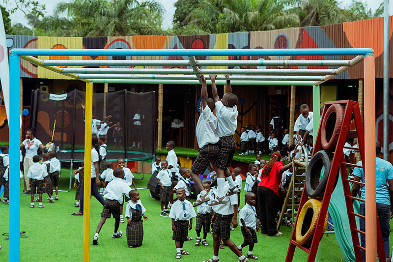 Children playing on a school playground at a Slum2School Africa learning centre, supporting holistic child development