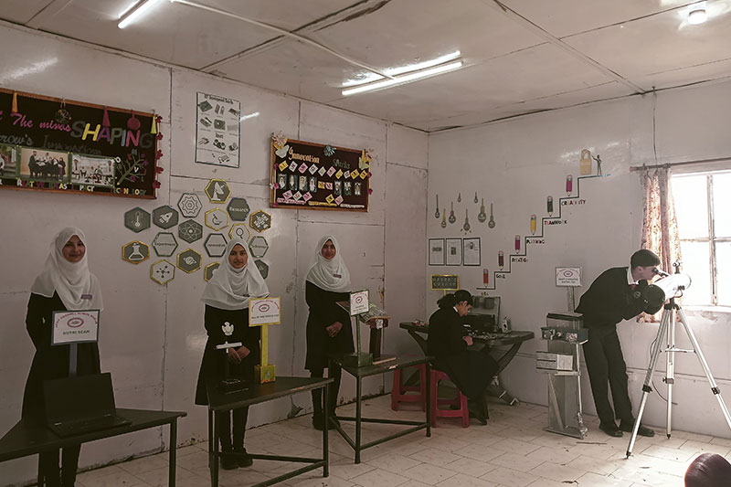 Students presenting science and technology projects in a classroom innovation exhibition at Army Good Will School Wuzur