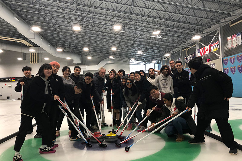 Canada Royal Arts High School students participating in a curling activity as part of cultural and recreational learning