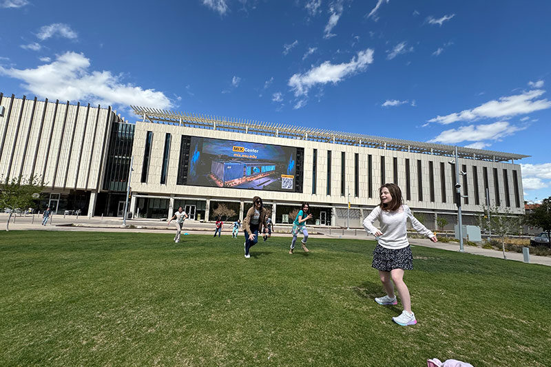 Students enjoying outdoor learning and recreation on the Arizona State University campus through Khan World School programmes