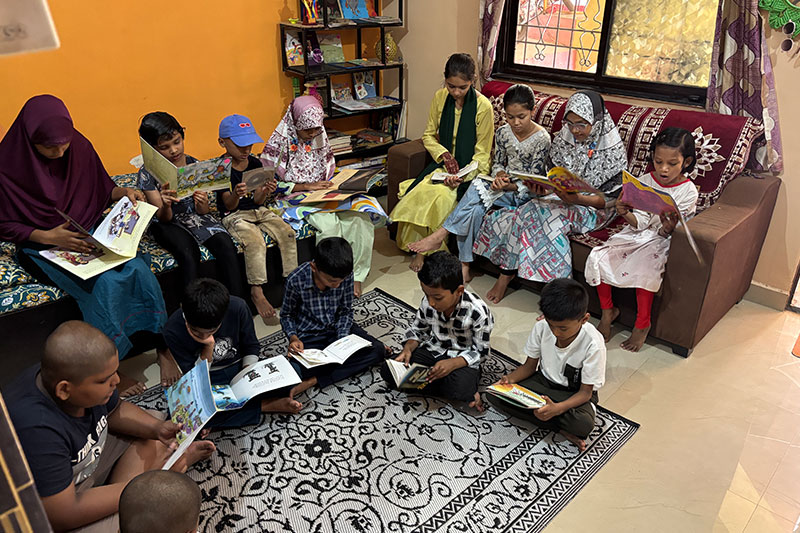 Children and families participating in a community reading programme and literacy initiative