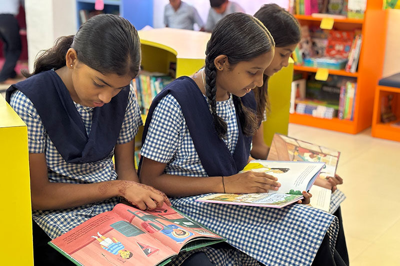 Students reading books together in a school library at a Pimpri Chinchwad Municipal Corporation education centre