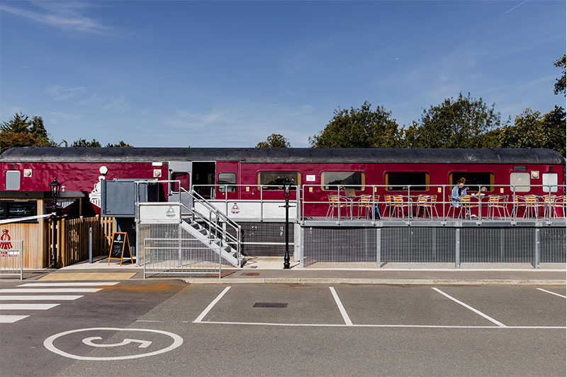 Converted railway carriage learning facility providing unique educational and vocational spaces at Five Acre Wood School
