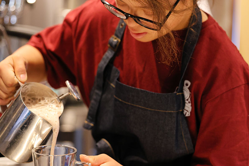 Student developing barista and hospitality skills through practical vocational training at Five Acre Wood School