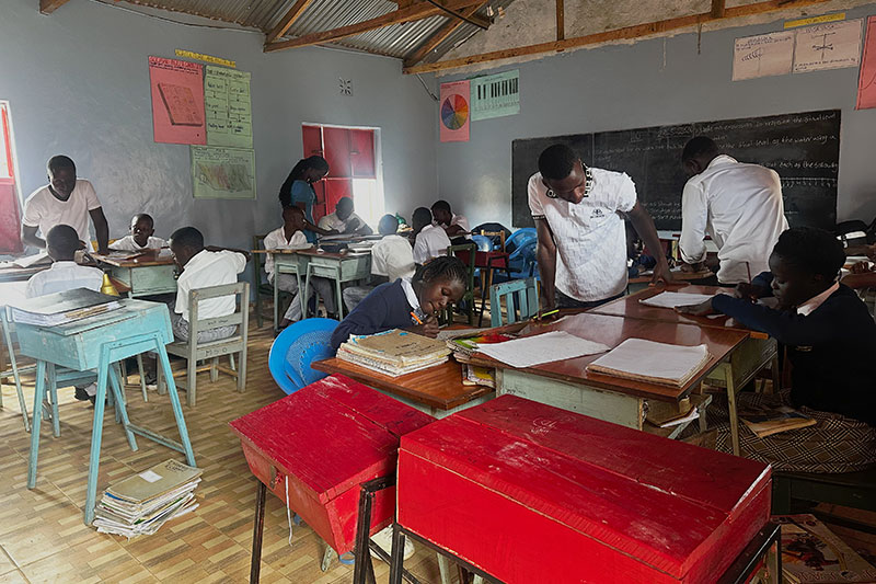 Teachers supporting students during a classroom learning session at Roshen Lakeview Academy