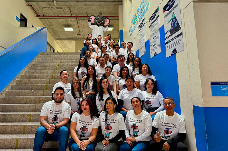 Colegio Las Margaritas educators and student support staff gathered on a school staircase promoting inclusive education and student wellbeing