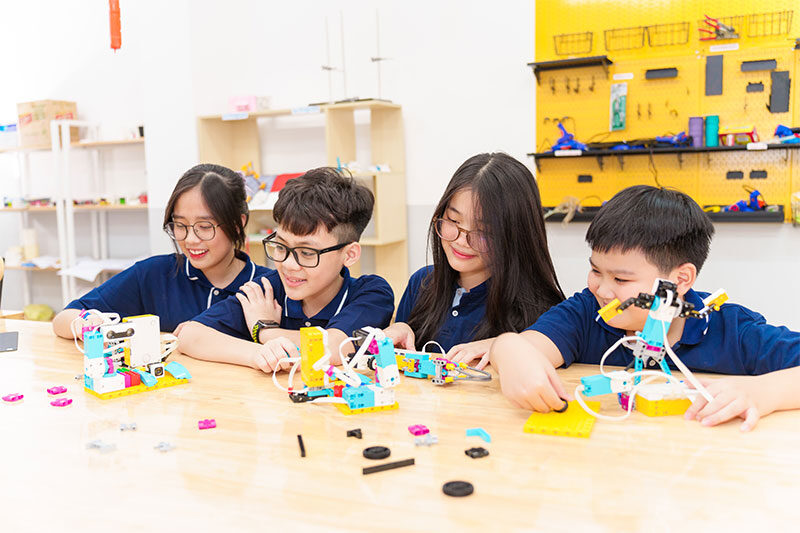Students collaborating on robotics and STEM engineering projects at Inspire Schools innovation lab