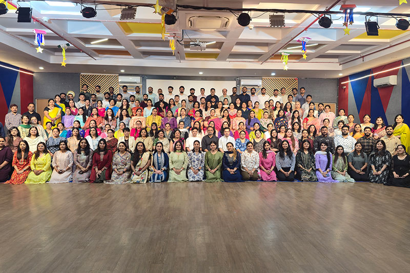 Faculty and staff group photograph celebrating the academic community at Seth Anandram Jaipuria School
