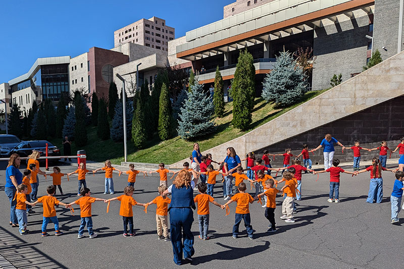 Young learners participating in an outdoor educational activity promoting teamwork and social development